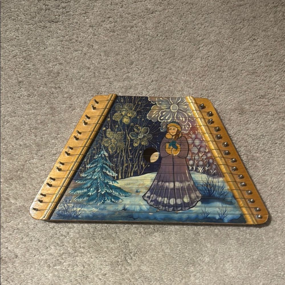 Hand-Painted Musical Instrument with Winter Scene